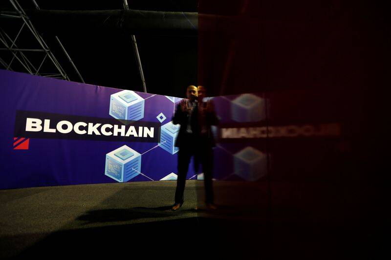 A delegate talks on his phone at the Delta Summit, Malta's official Blockchain and Digital Innovation event promoting cryptocurrency, in Ta' Qali